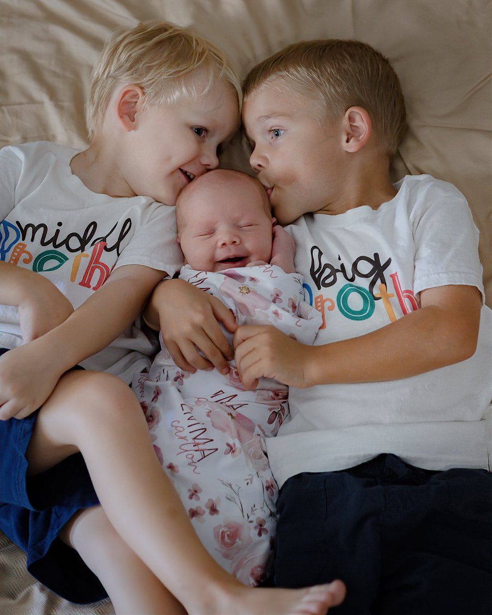 Toddler brothers with newborn baby sister, in-home family session