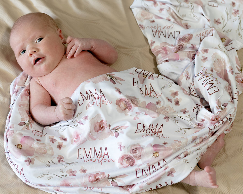 Newborn baby girl laying on bed, lifestyle newborn photography, Lakewood Ranch, Florida