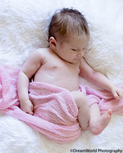 Baby in loose pink wrap