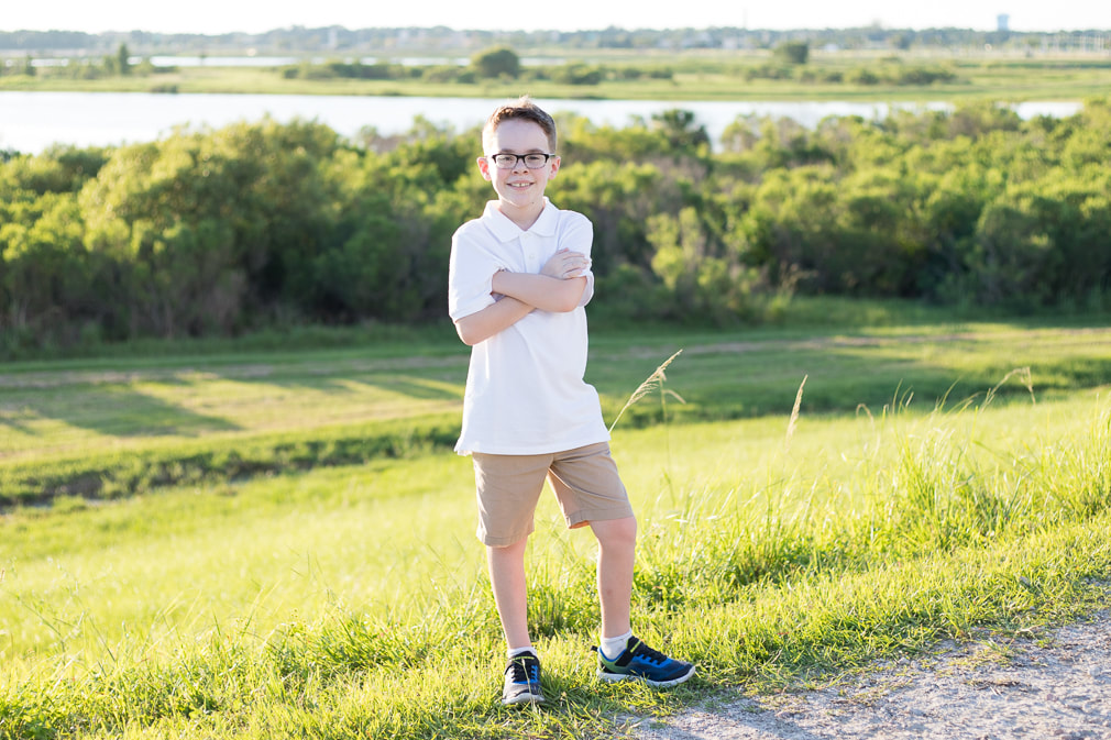 9 year old boy standing outside with arms folded, Celery Fields Sarasota