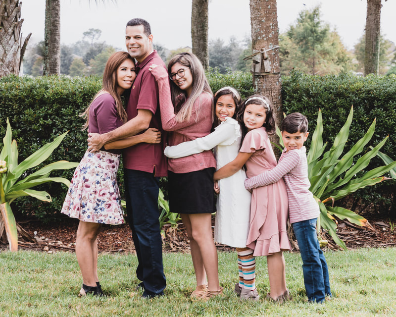 Family of six outside in a line hugging each other, Lakewood Ranch, Florida, lifestyle family