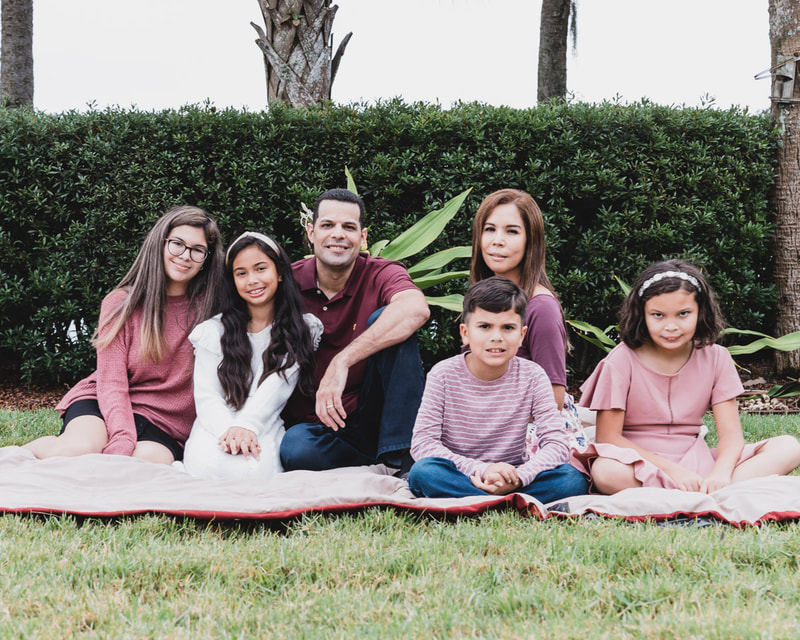 Family of six sitting on ground outside, Lakewood Ranch, Florida, lifestyle family